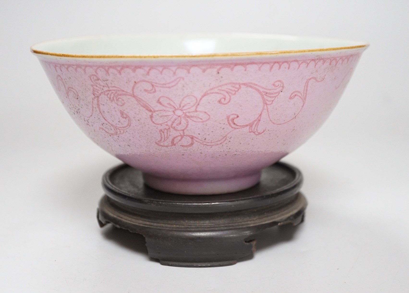 An early 19th century? Chinese powder pink ground export porcelain bowl, 17cm (a.f.), on associated pierced carved hardwood stand